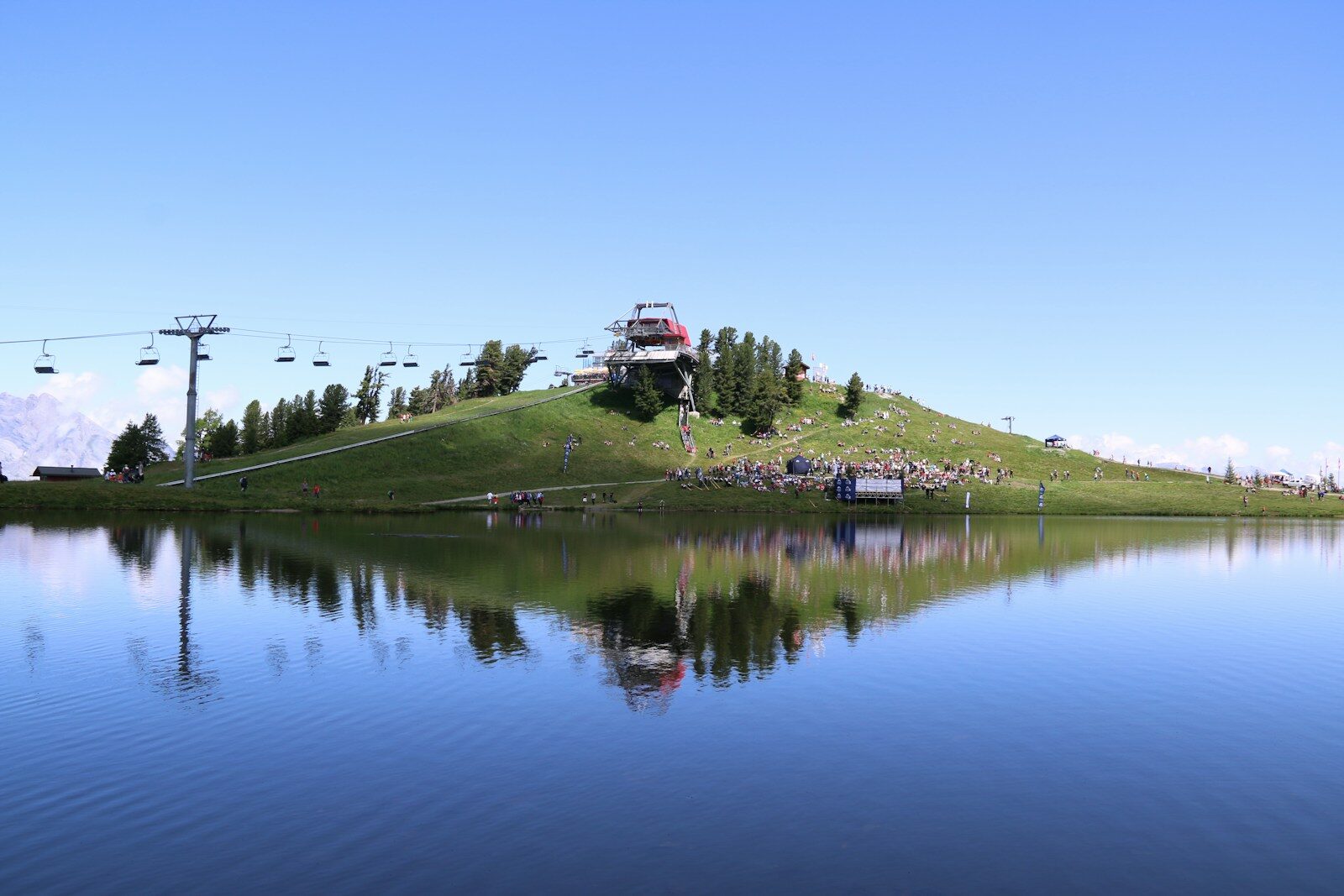 Photo by Jon K body of water near green grass field during daytime