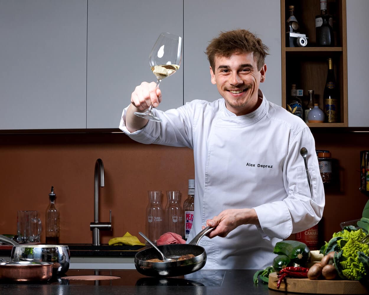 person holding amber glass bottle